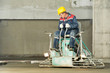 Worker trowelling and finishing of concrete Worker trowelling and finishing of concrete