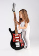 Photo: Small child hold red acoustic guitar. Music concept. On gray bac Small child hold red acoustic guitar. Music concept. On gray bac