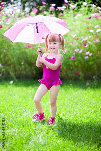 Photo: Little girl in the garden Little girl in the garden