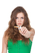 Pretty young woman breaking cigarette isolated over white
