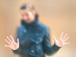 Foto: Silhouette of a girl through frosted glass Silhouette of a girl through frosted glass