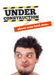 Young head looking at contruction icons