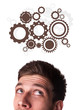 Young person looking at idea type of sign