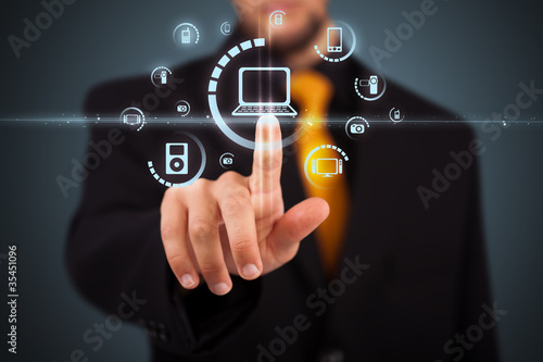 사진:Businessman pressing virtual media type of buttons Businessman pressing virtual media type of buttons