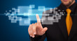 Businessman pressing high tech type of modern buttons