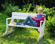 woman reading book in park