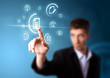 Businessman pressing virtual messaging type of icons