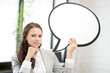 smiling businesswoman with blank text bubble
