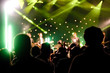 Photo: silhouette of an audience at a music concert silhouette of an audience at a music concert