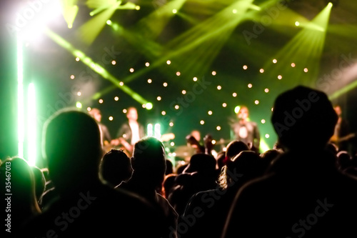 Photo: silhouette of an audience at a music concert silhouette of an audience at a music concert