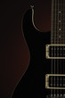 Black Electric Guitar on Red
