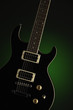 Black Electric Guitar on Green