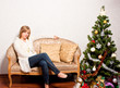 young woman   near a fir-tree