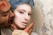 Vampire biting woman's neck