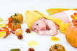 Baby amongst leaves and vegetables