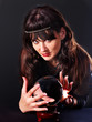Young woman  with crystal ball.