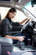 Young woman in the new car