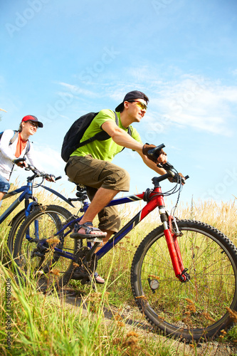 Photo: cyclists on meadow cyclists on meadow