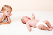 Toddler girl and newborn baby