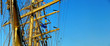 masts and details of sailing ship and blue sky