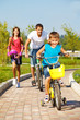 Photo: School aged boy and his father cycling School aged boy and his father cycling