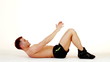 Handsome muscular man exercising on white background