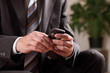 Foto: Business man text messaging Business man text messaging