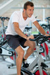 Man doing spinning at the gym