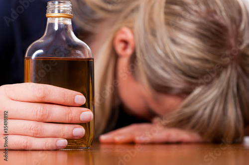 Photo: Alcohol abuse - woman drinking too much brandy Alcohol abuse - woman drinking too much brandy