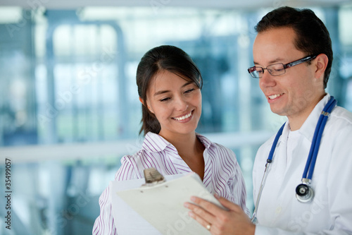 Photo: Insurance agent with a doctor Insurance agent with a doctor