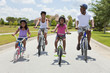 African American Family Parents and Children Cycling