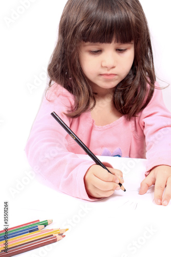 Photo: Little preschooler drawing or writing Little preschooler drawing or writing