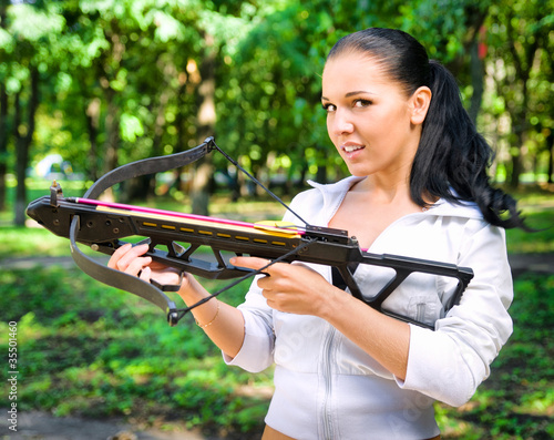 Photo: beautiful young girl with arbalest beautiful young girl with arbalest