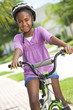 Happy African American Girl Riding Bike Smiling