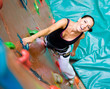 women climbing on a wall