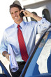Businessman or Architect On Cell Phone By Car