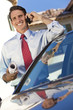 Businessman or Architect On Cell Phone By Car
