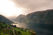 houses standing on a fjord coast at the overcast day