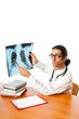 Male doctor looking at x-ray image