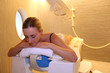Woman laying down table for spa treatment