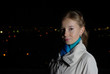 Intelligent girl in a beige coat against the night city Intelligent girl in a beige coat against the night city
