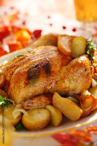 Photo: Whole roasted chicken with potatoes and apples Whole roasted chicken with potatoes and apples