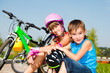 Photo: Boy and his sister in protective cycling helmets Boy and his sister in protective cycling helmets