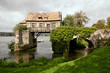 The old mill on medieval bridge in Vernon, Normandy The old mill on medieval bridge in Vernon, Normandy