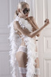 posing model in lingerie next to a doorway