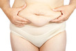 Fat woman pinching her fat tummy