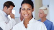 Portrait of successful female doctor smiling