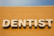 Photo: Dentist sign on the brick wall Dentist sign on the brick wall