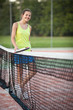 pretty, young female tennis player on the tennis court pretty, young female tennis player on the tennis court