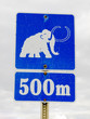 Funny mammoth symbol on road sign